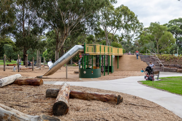 Wattle park metal slide for kids, kids playing in the park, mum pushing a stroller