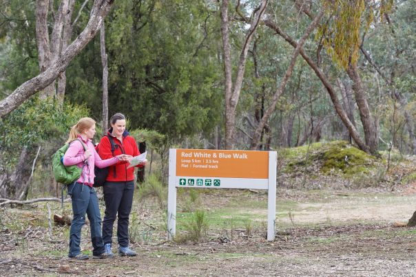 An orange sign reads 'Red White and Blue Walk'