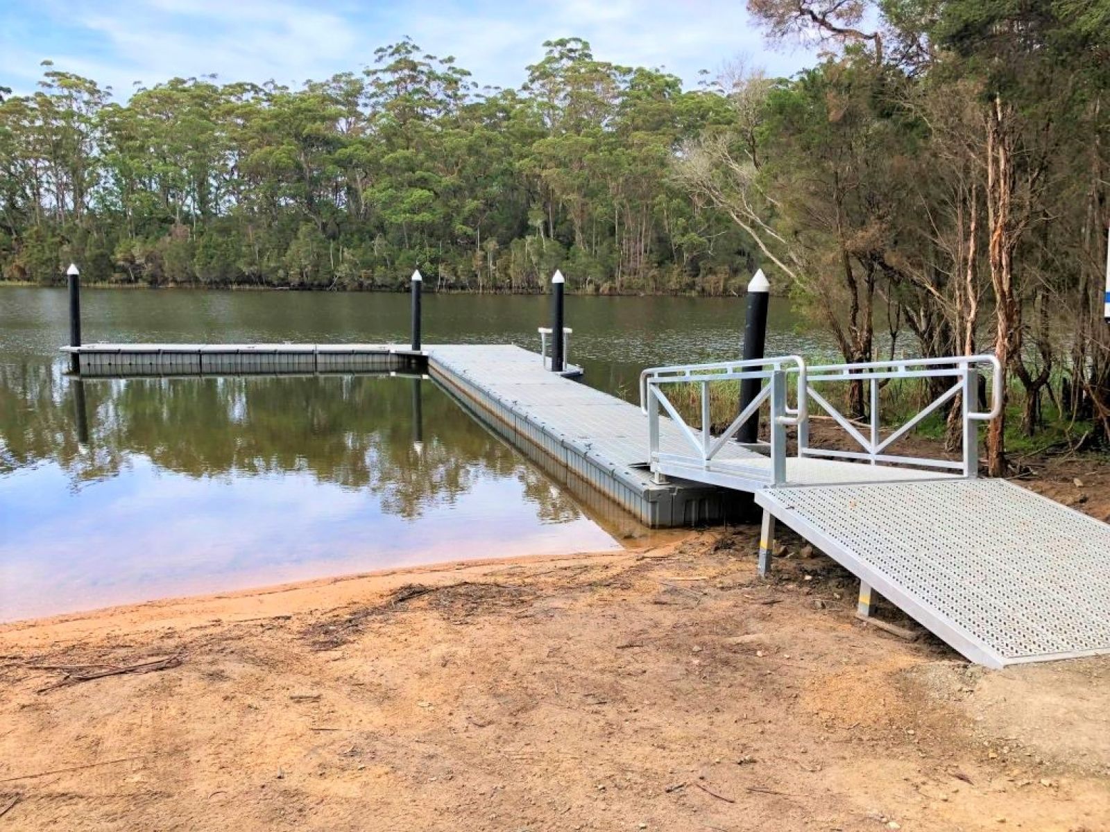 A boat jetty on the edge of a lake