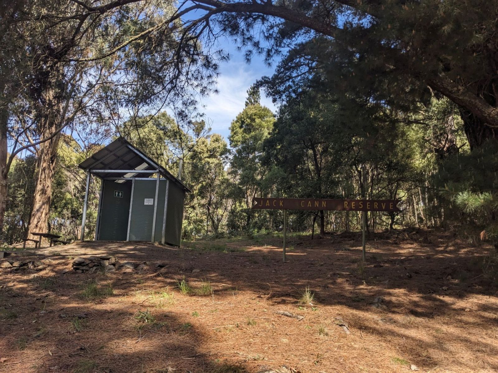 A small basic toilet on a ridge