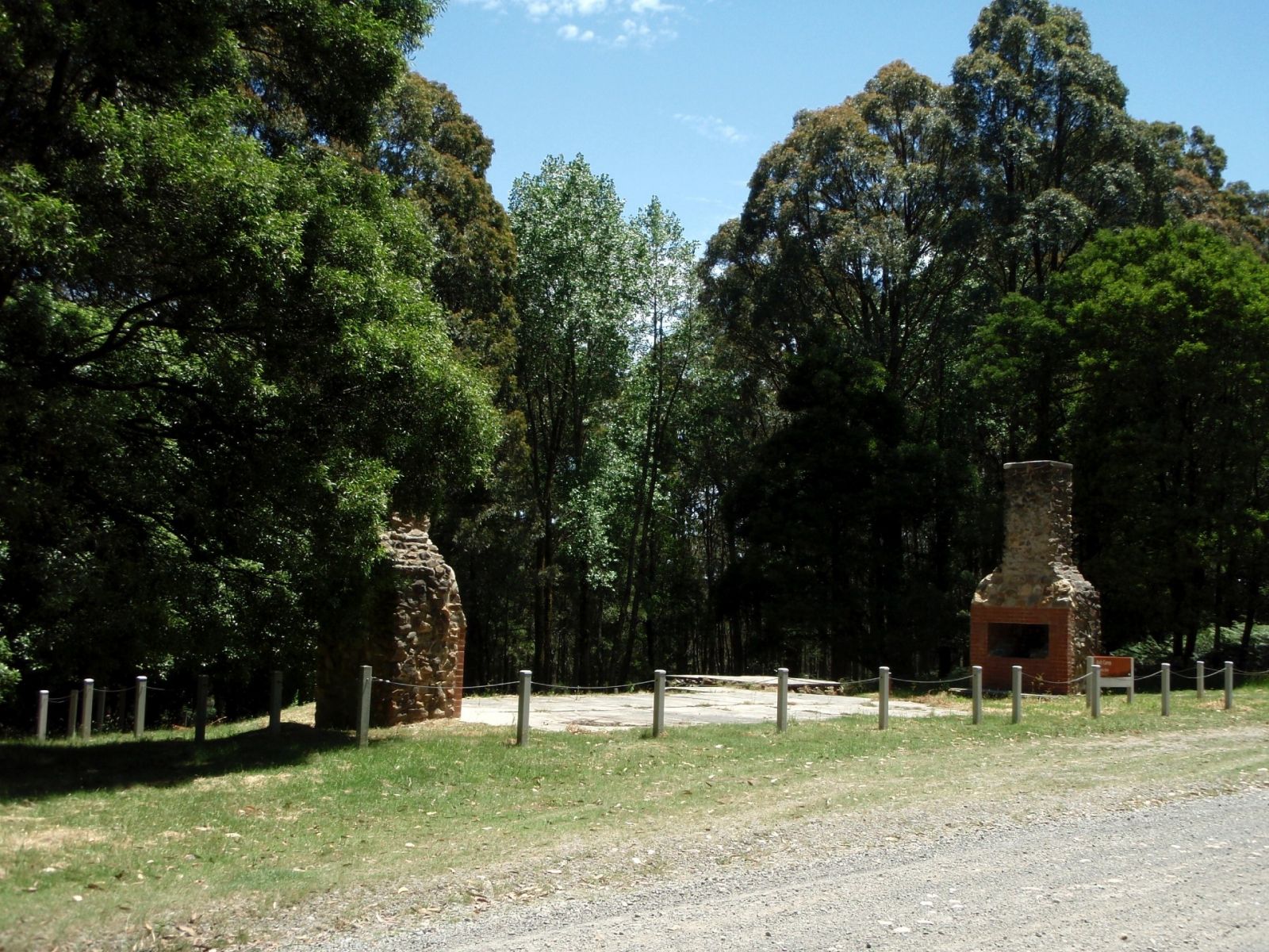 A historical site featuring two brick entry gates